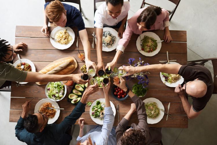 New Homeowners Celebrating with Family at dinner table