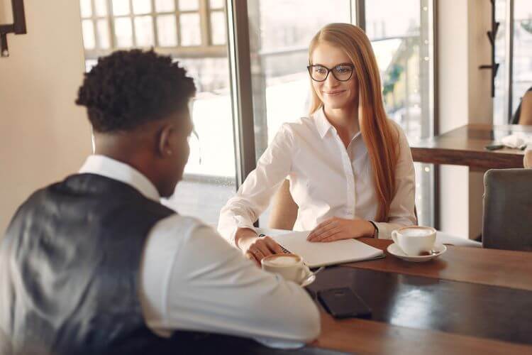 Woman Learns about mortgage programs over coffee