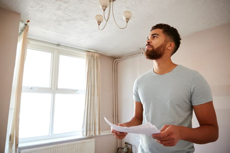 Man planning rehab of first investment property