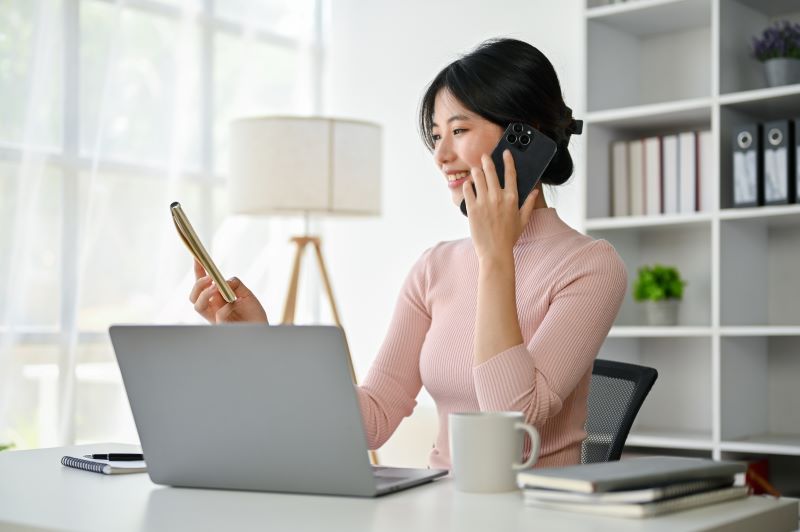 Woman on phone and computer